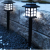 lampy solarne LED ogrodowe przy murku z kamienia na tle żwiru.png