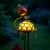 lampa solarna żółw LED świecąca nocą w ogrodzie.png